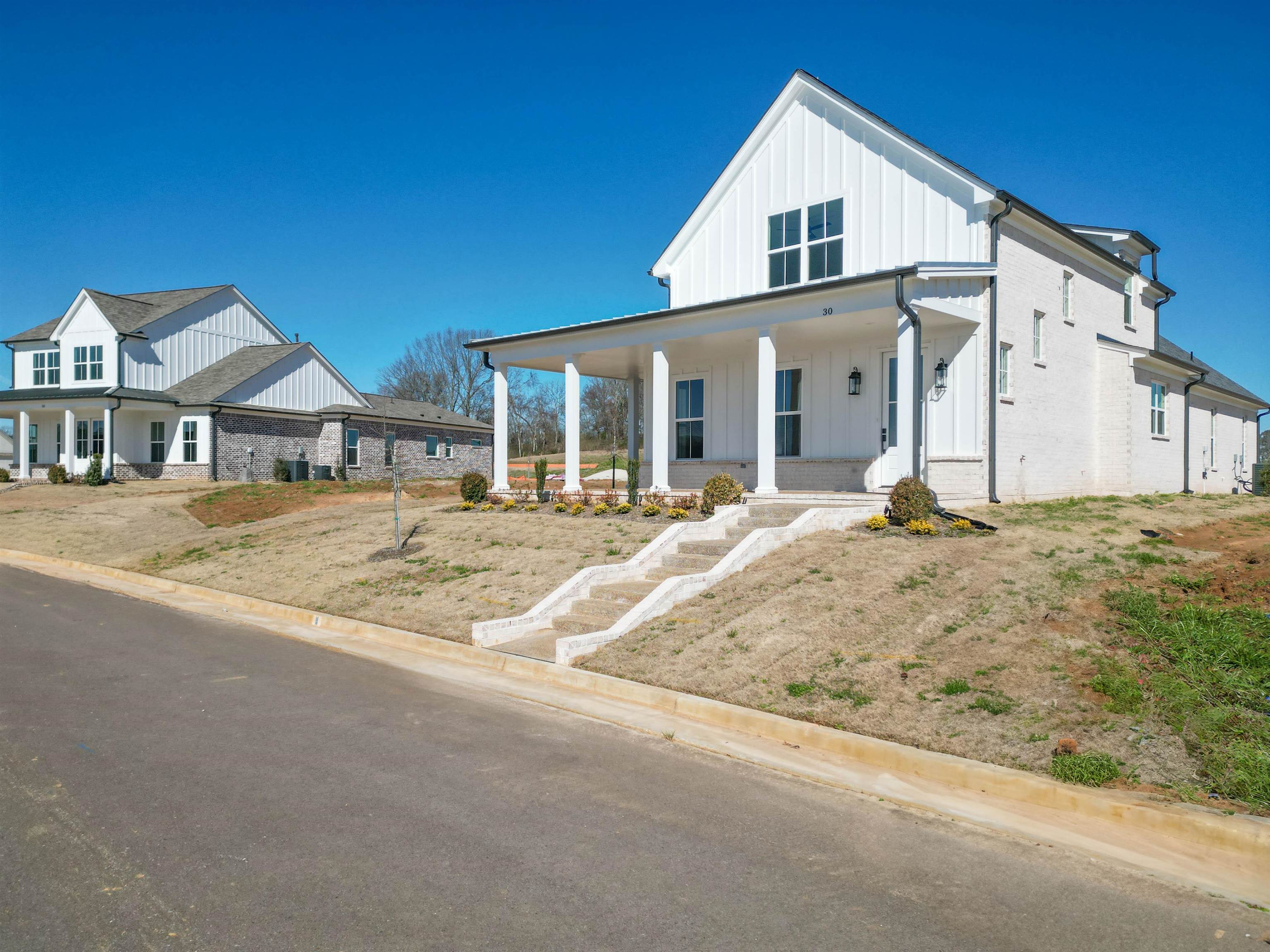 30 Rambling Rex Trail Piperton, TN 38017 - Photo 3 of 27 Modern farmhouse style home with covered porch and board and batten siding