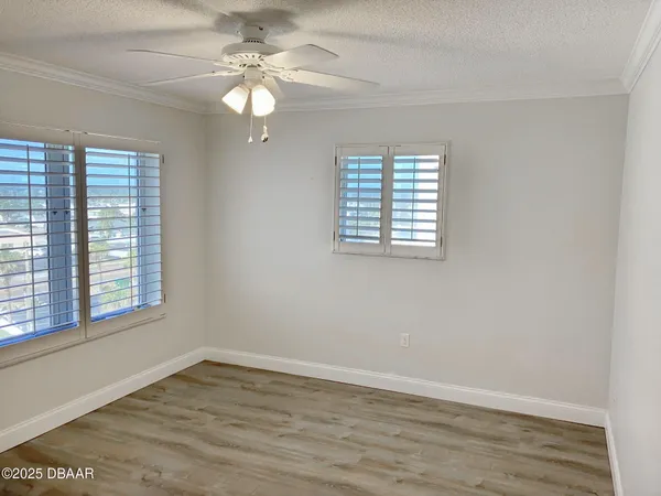 a view of a livingroom with wooden floor
