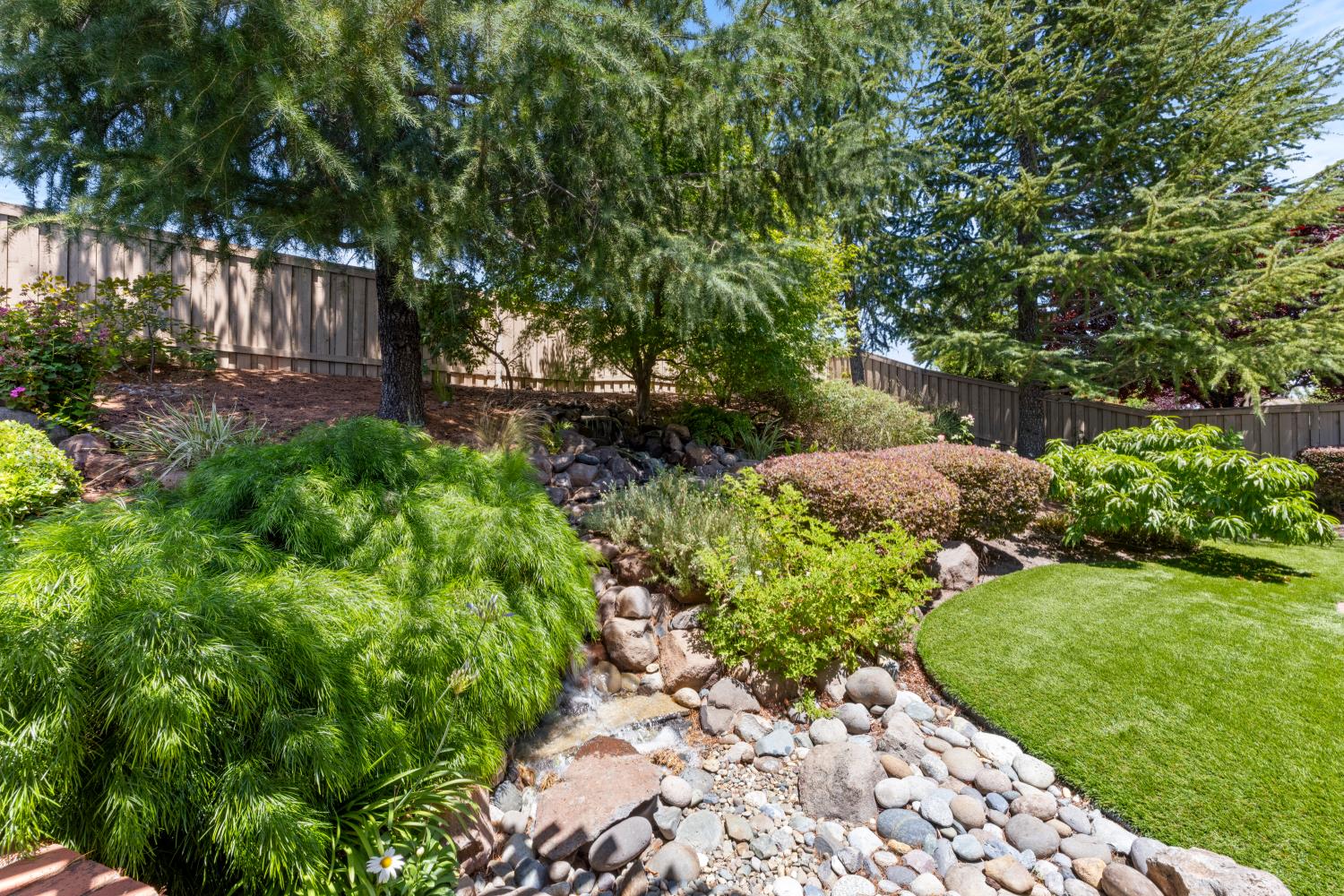 2306 Longspur Loop Lincoln, CA 95648 - Photo 52 of 59 Stunning waterfall feature - the photos do not capture the beauty