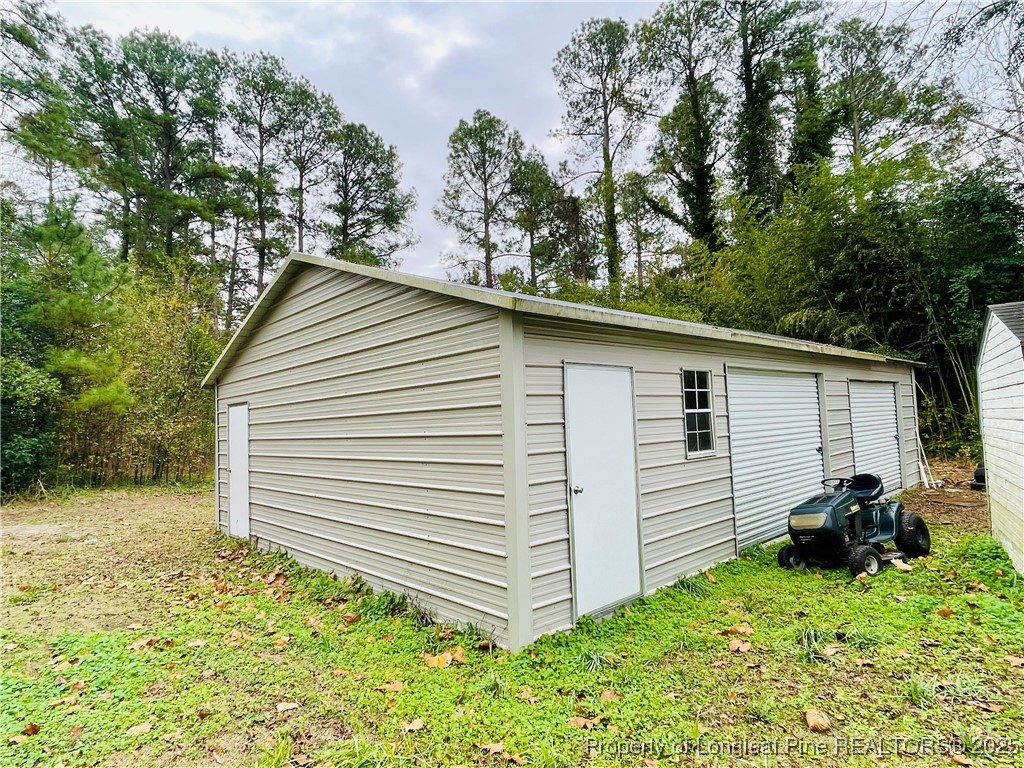 405 South Austin Street Maxton, NC 28364 - Photo 12 of 41 a view of a house with a yard