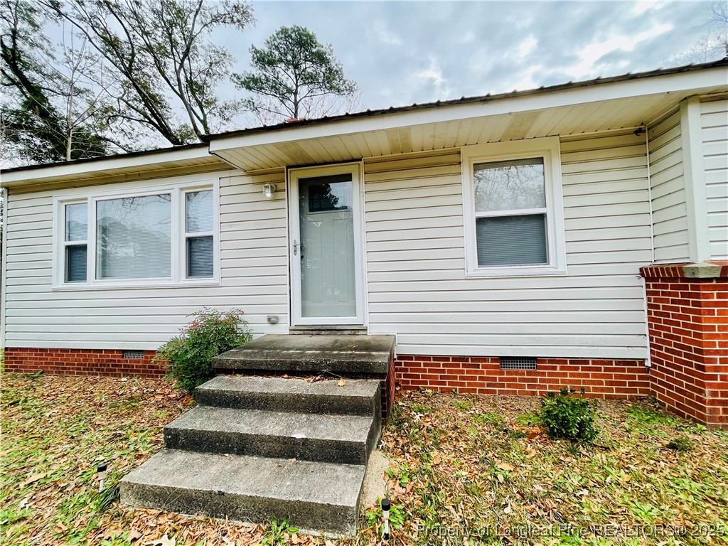 405 South Austin Street Maxton, NC 28364 - Photo 17 of 41 a view of a house with a yard