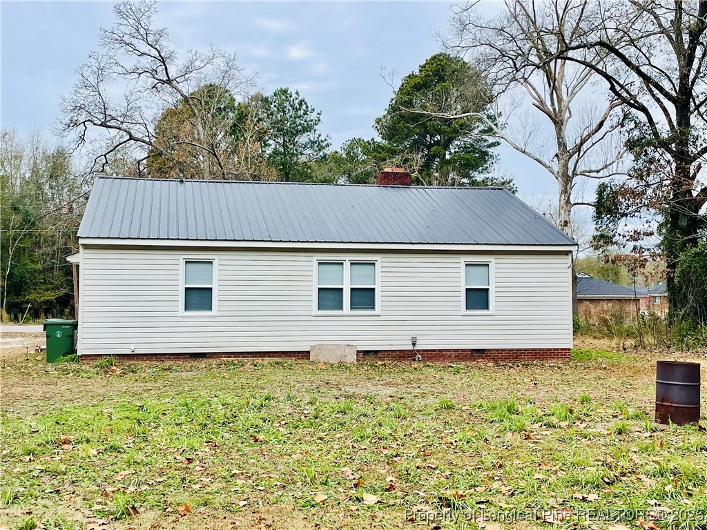 405 South Austin Street Maxton, NC 28364 - Photo 8 of 41 a house with trees in the background