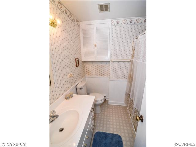 3920 Huntwood Road Richmond, VA 23235 - Photo 11 of 20 a bathroom with a sink and a mirror