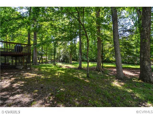 3920 Huntwood Road Richmond, VA 23235 - Photo 18 of 20 a view of a backyard with trees