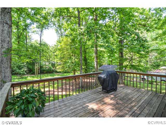 3920 Huntwood Road Richmond, VA 23235 - Photo 20 of 20 a view of a wooden deck and a yard