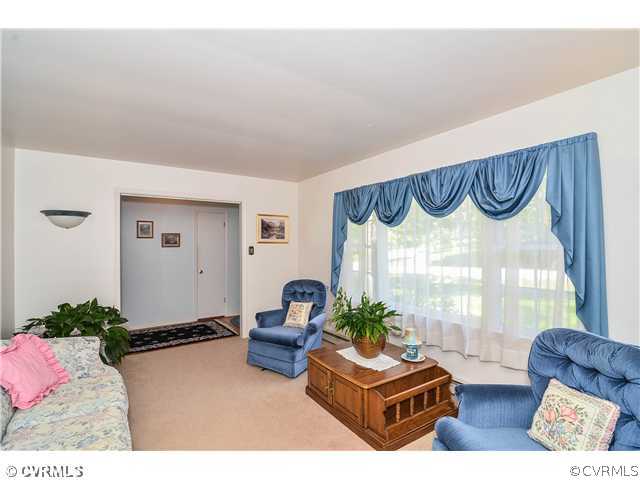 3920 Huntwood Road Richmond, VA 23235 - Photo 3 of 20 a living room with furniture and a wooden floor