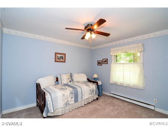 3920 Huntwood Road Richmond, VA 23235 - Photo 7 of 20 a bedroom with a bed and a window