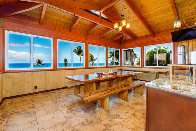 a view of a patio with swimming pool table and chairs