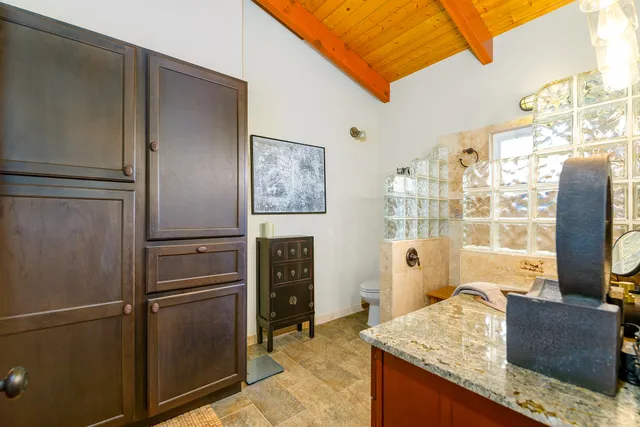 a kitchen with stainless steel appliances granite countertop a refrigerator and a stove