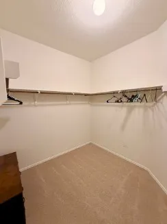 a spacious bathroom with a double vanity sink and a mirror