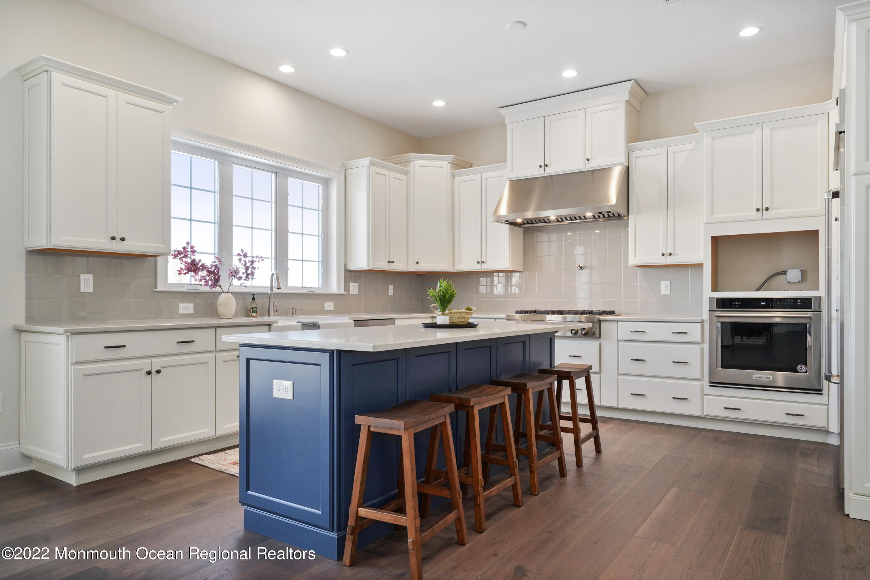 66 Windermere Road Lincroft, NJ 07738 - Photo 17 of 61 a kitchen with stainless steel appliances granite countertop a stove top oven a sink dishwasher and a refrigerator with wooden floor