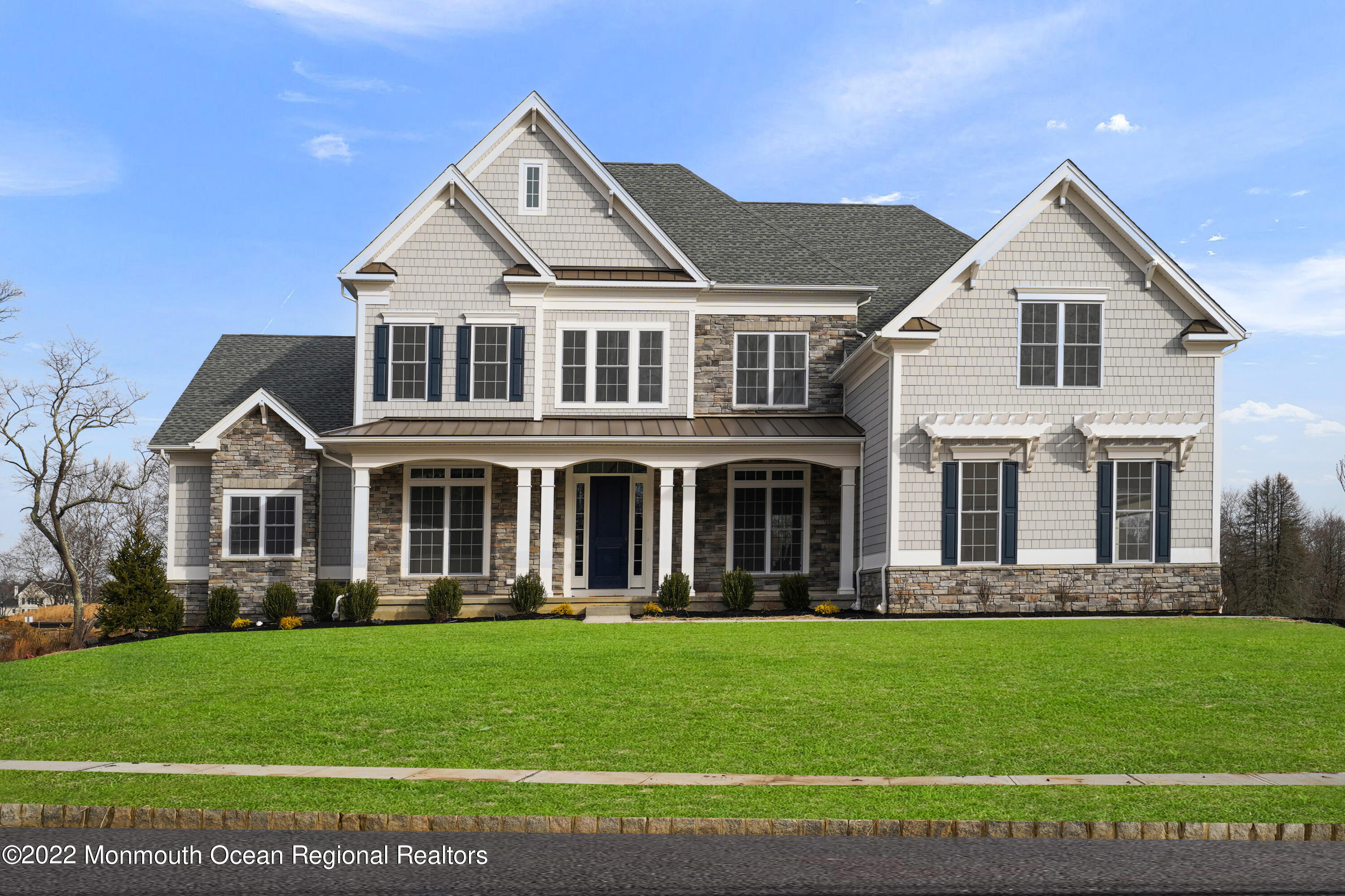 66 Windermere Road Lincroft, NJ 07738 - Photo 2 of 61 a front view of a house with a yard