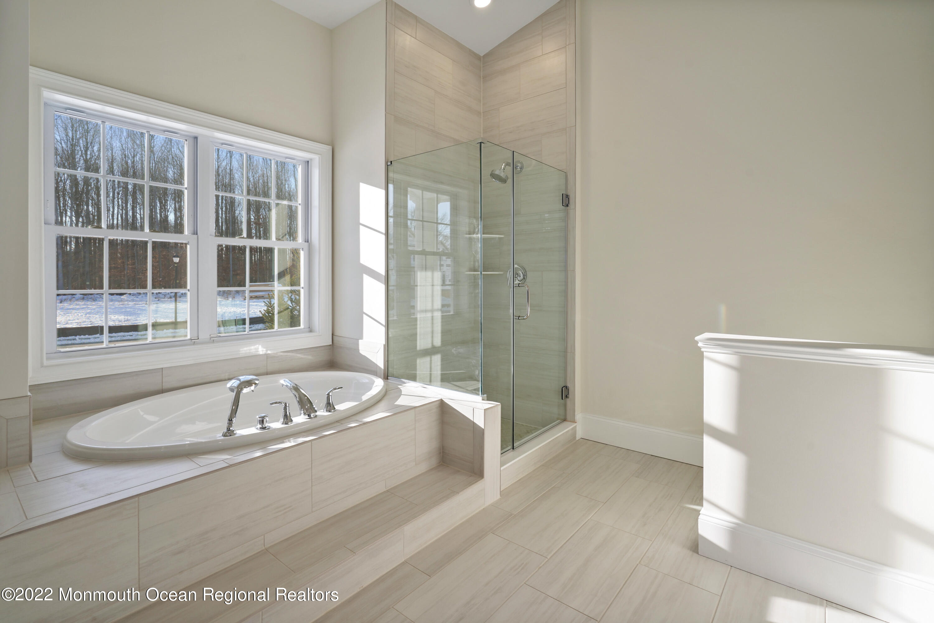 66 Windermere Road Lincroft, NJ 07738 - Photo 26 of 61 a bathroom with a tub a sink and a window