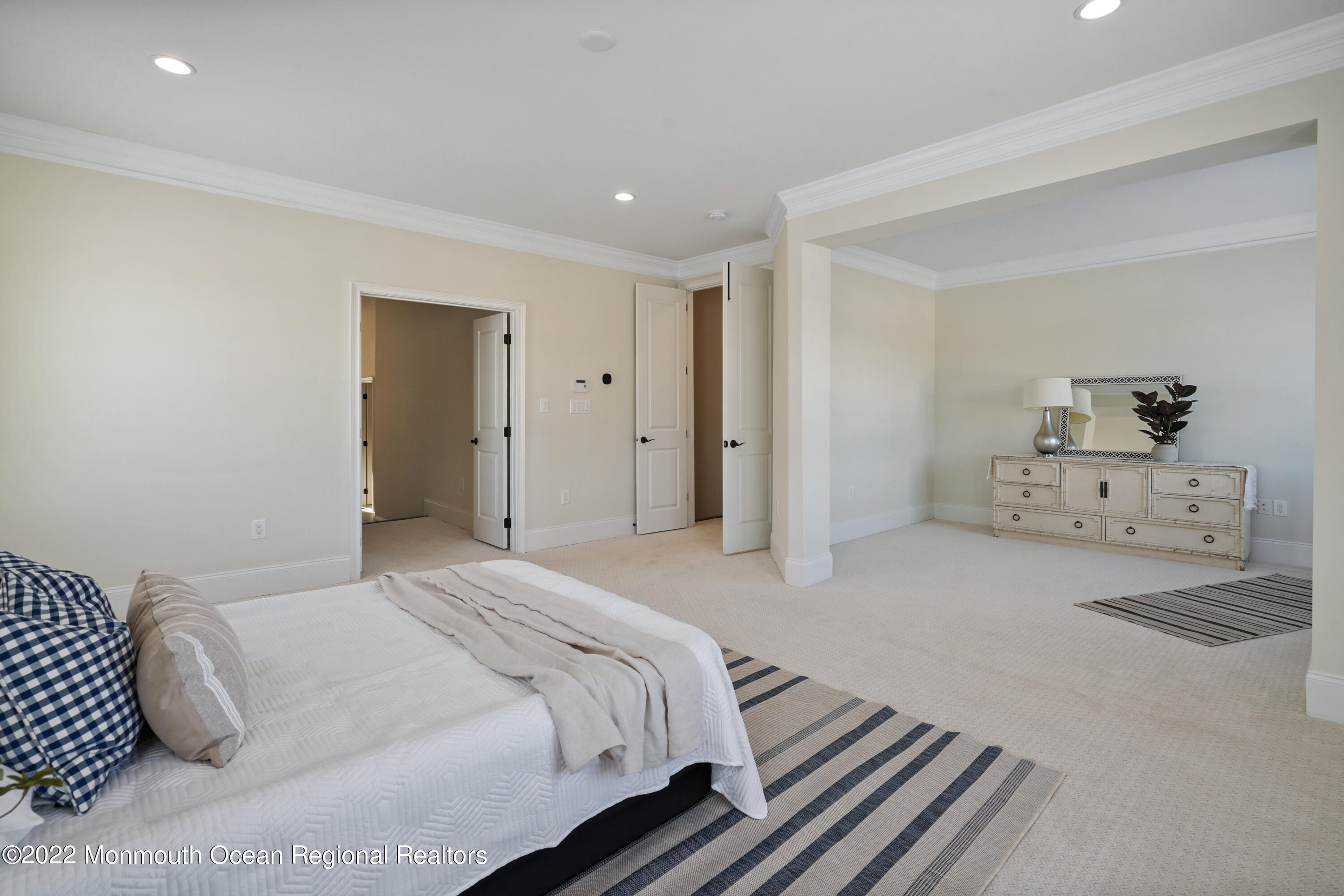 66 Windermere Road Lincroft, NJ 07738 - Photo 33 of 61 a spacious bedroom with a bed and cabinets