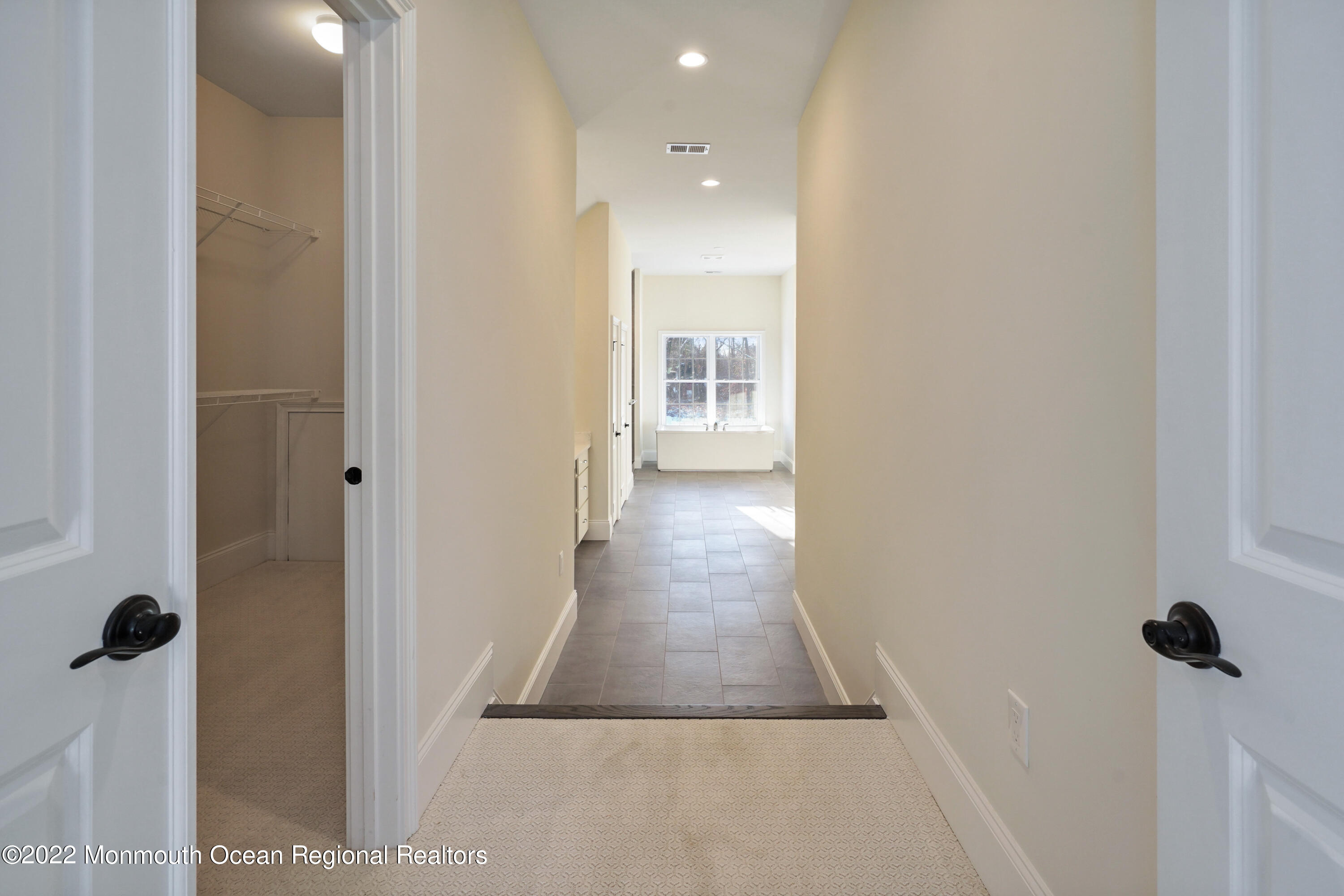 66 Windermere Road Lincroft, NJ 07738 - Photo 36 of 61 a view of a hallway with wooden floor and staircase