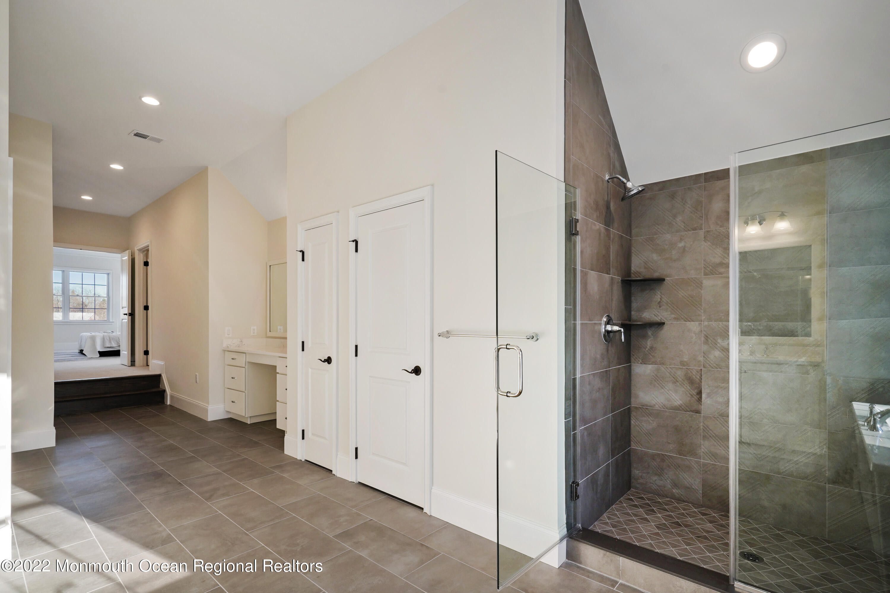 66 Windermere Road Lincroft, NJ 07738 - Photo 41 of 61 a bathroom with a shower and a glass door