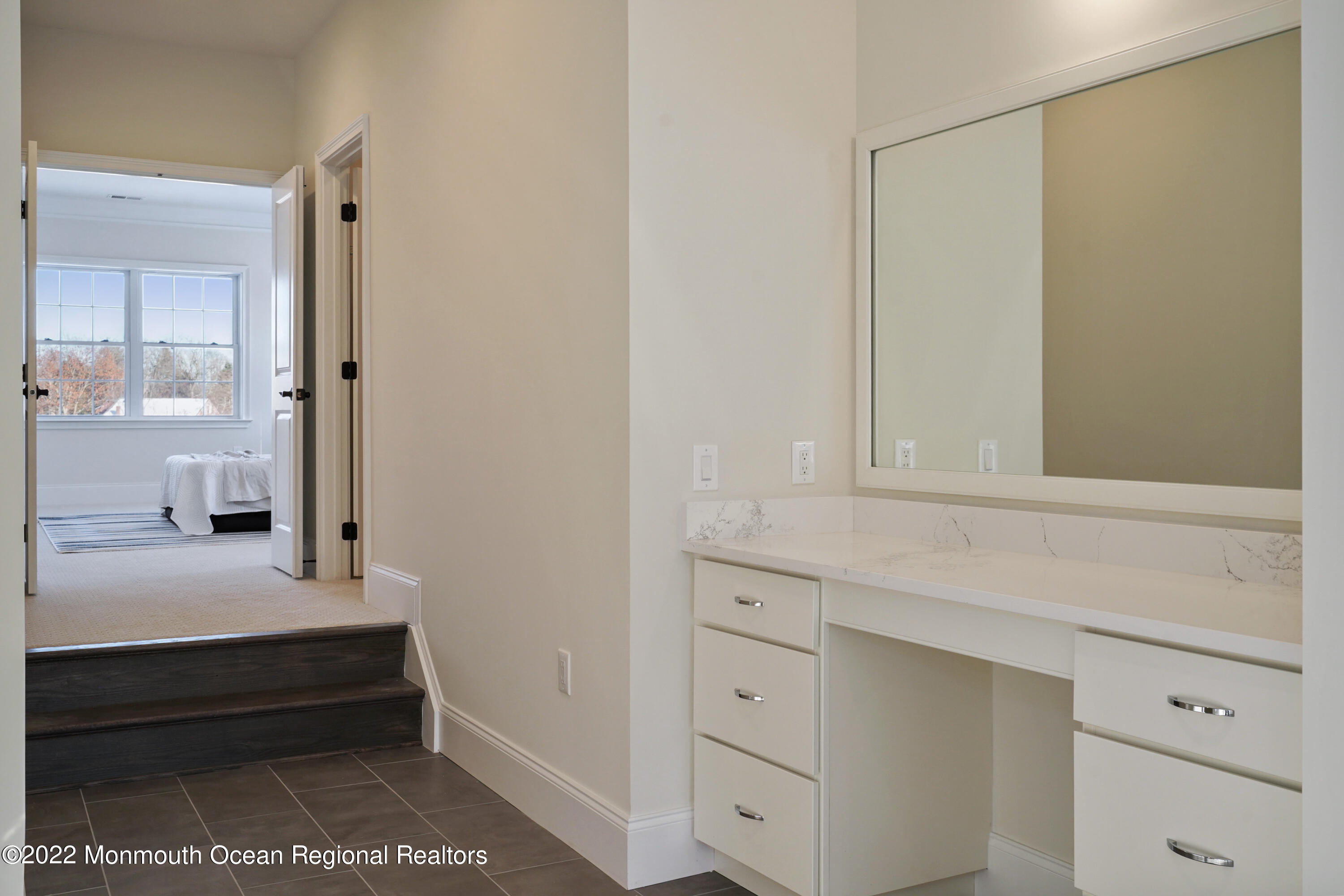 66 Windermere Road Lincroft, NJ 07738 - Photo 42 of 61 a bathroom with a vanity and mirror