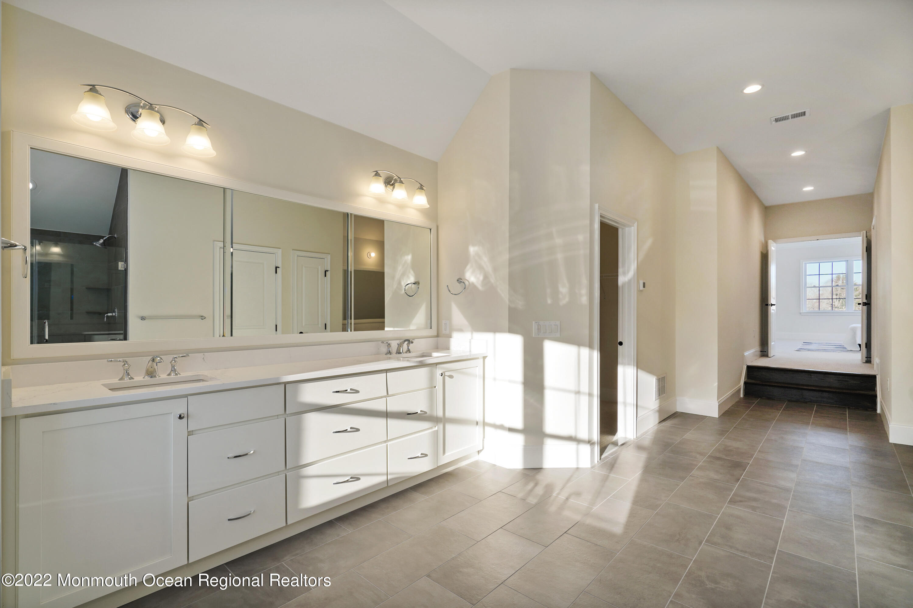 66 Windermere Road Lincroft, NJ 07738 - Photo 43 of 61 a bathroom with a double vanity sink and mirror