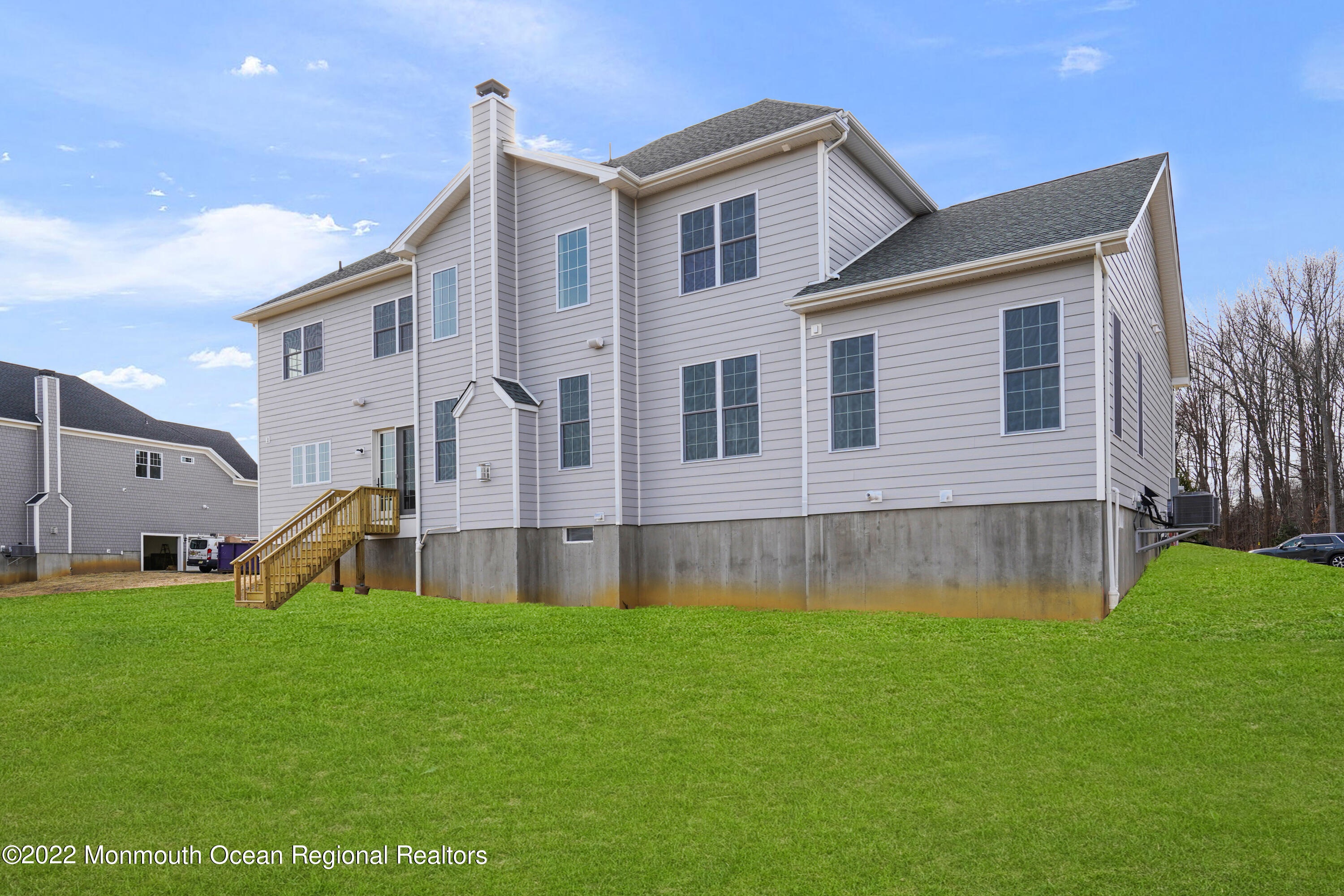 66 Windermere Road Lincroft, NJ 07738 - Photo 51 of 61 a front view of house with yard and green space