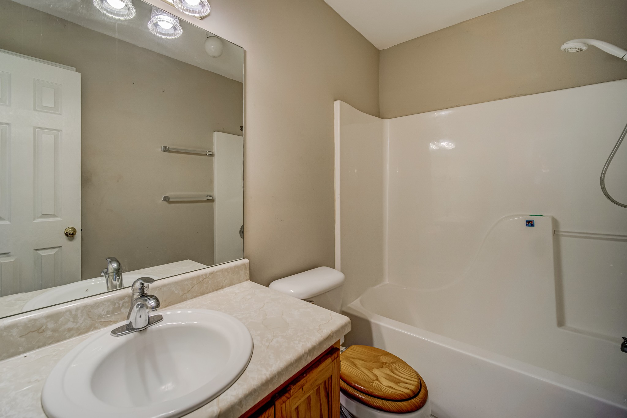 5160 Minnis Road Springfield, TN 37172 - Photo 16 of 31 a bathroom with a granite countertop sink and a mirror