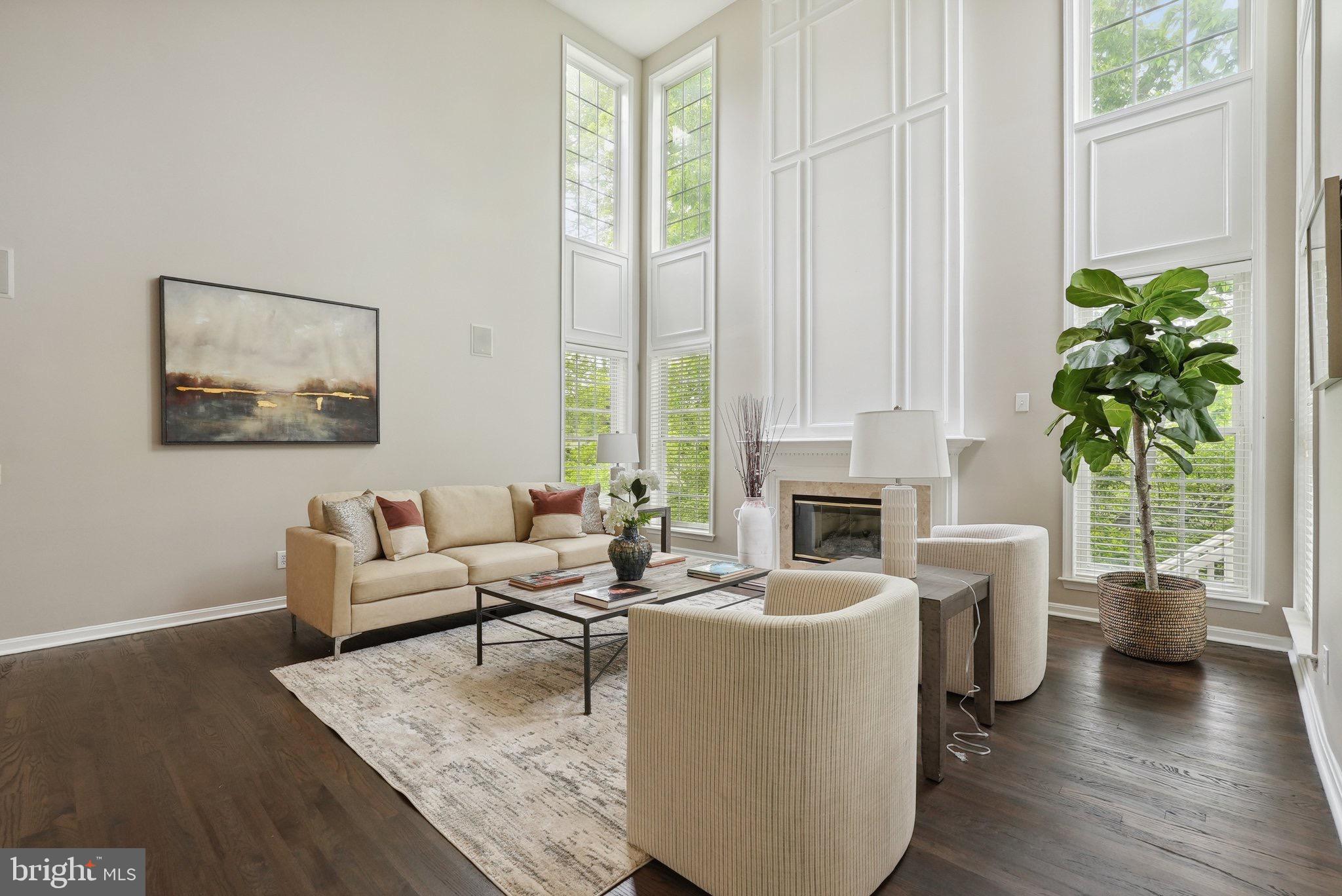 51 Knickerbocker Lane Malvern, PA 19355 - Photo 12 of 57 a living room with furniture a fireplace and a potted plant