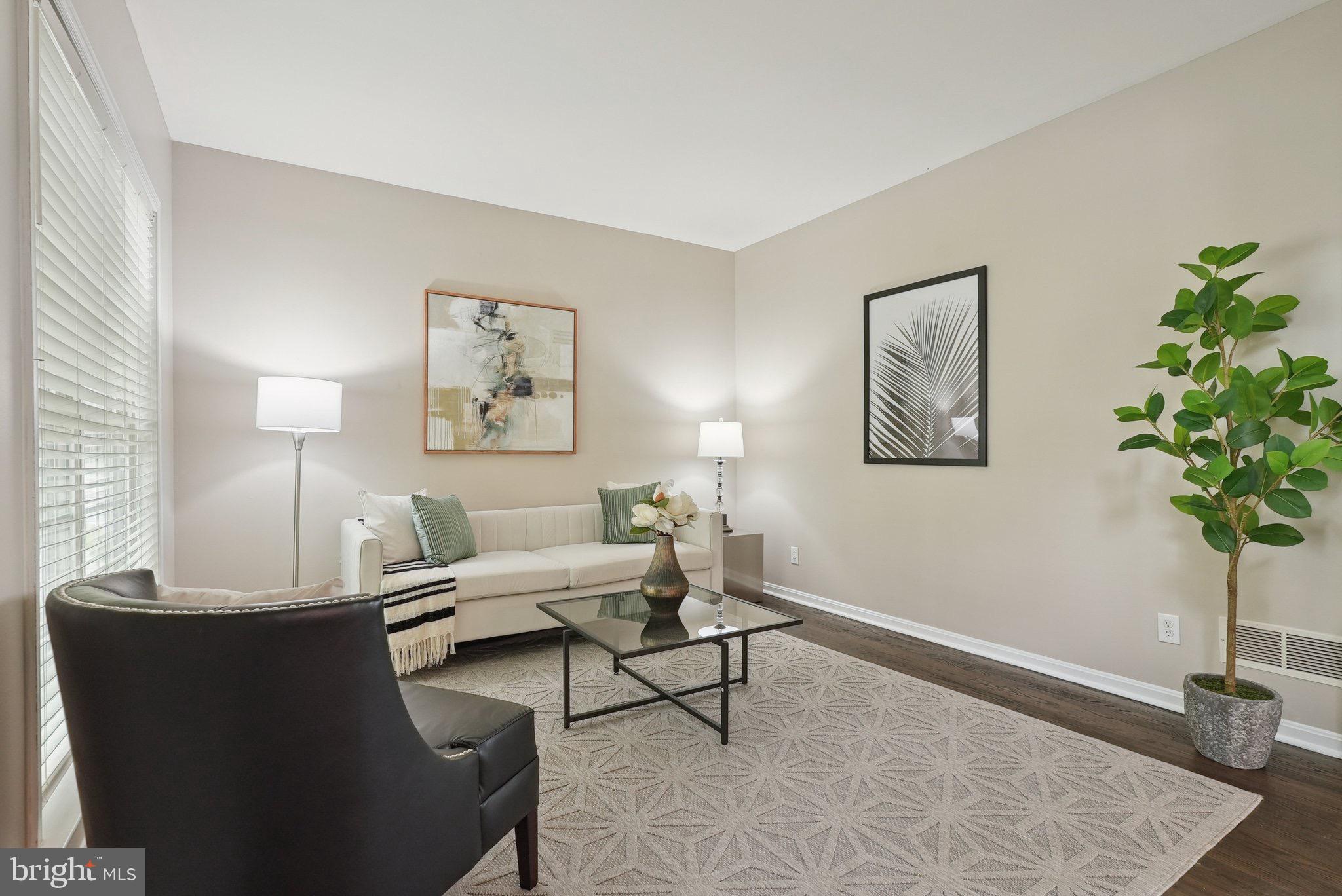 51 Knickerbocker Lane Malvern, PA 19355 - Photo 16 of 57 a living room with furniture and a potted plant