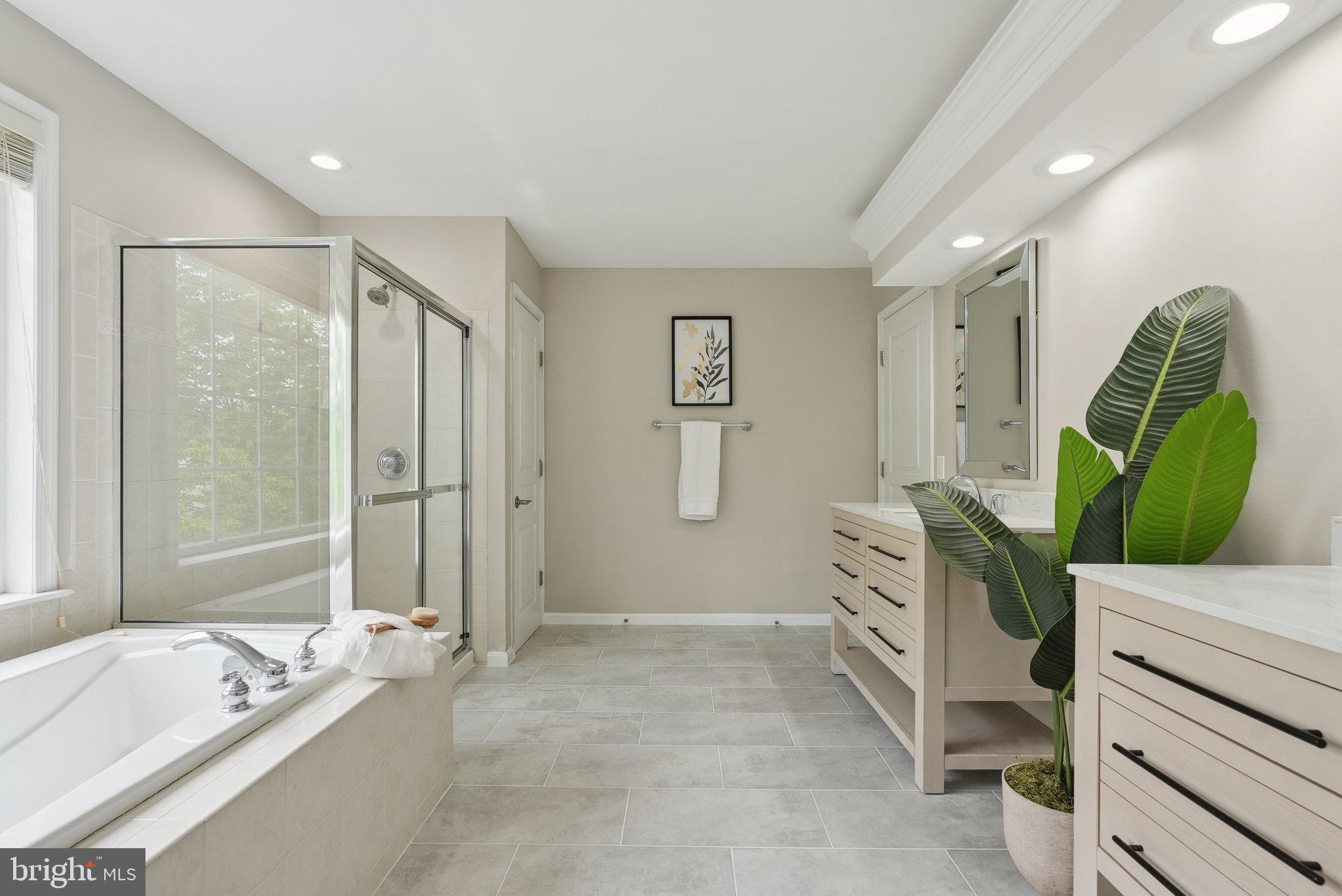 51 Knickerbocker Lane Malvern, PA 19355 - Photo 37 of 57 a bathroom with a tub sink and mirror