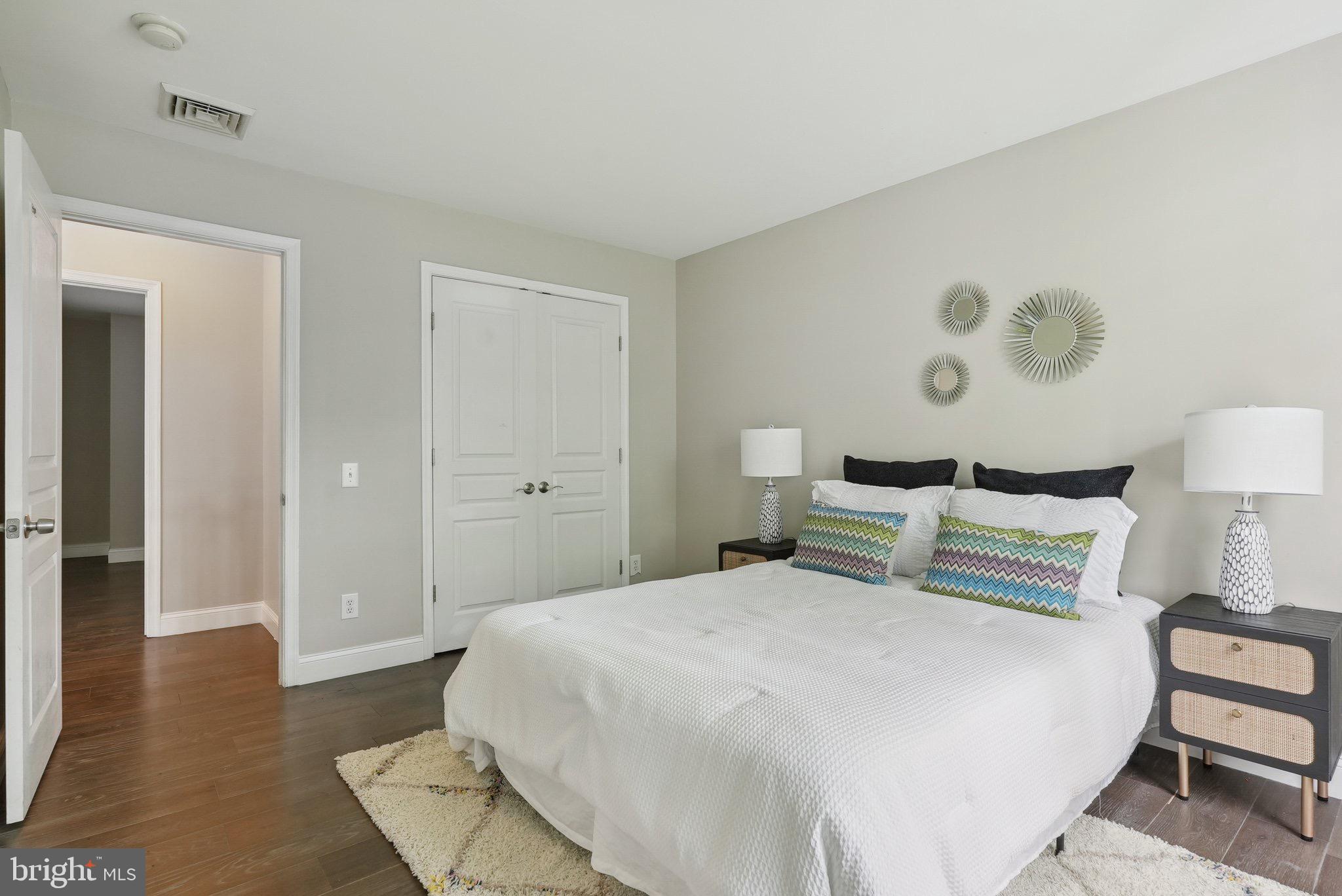 51 Knickerbocker Lane Malvern, PA 19355 - Photo 41 of 57 a bedroom with a bed and wooden floor