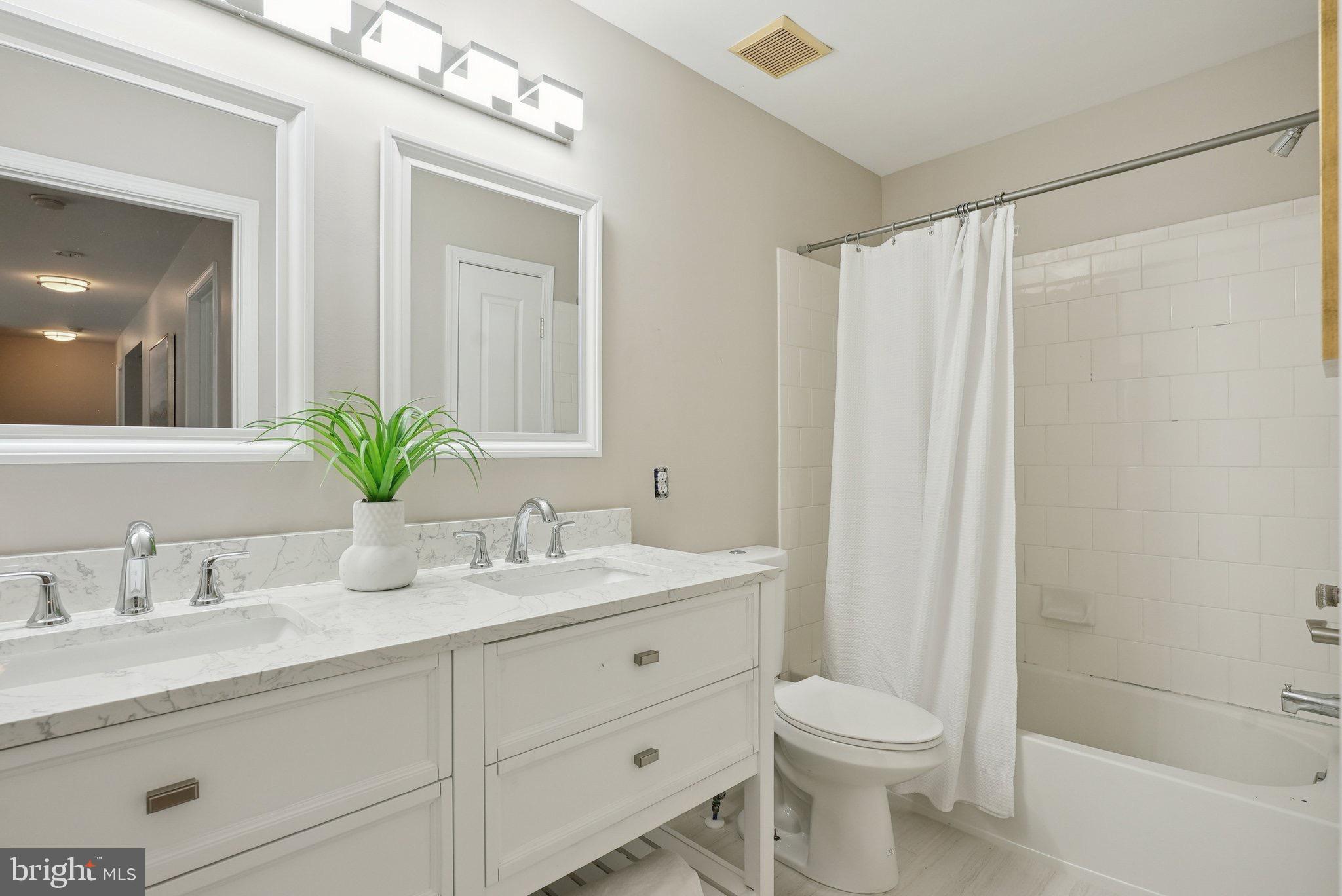 51 Knickerbocker Lane Malvern, PA 19355 - Photo 42 of 57 a bathroom with a granite countertop sink toilet and shower