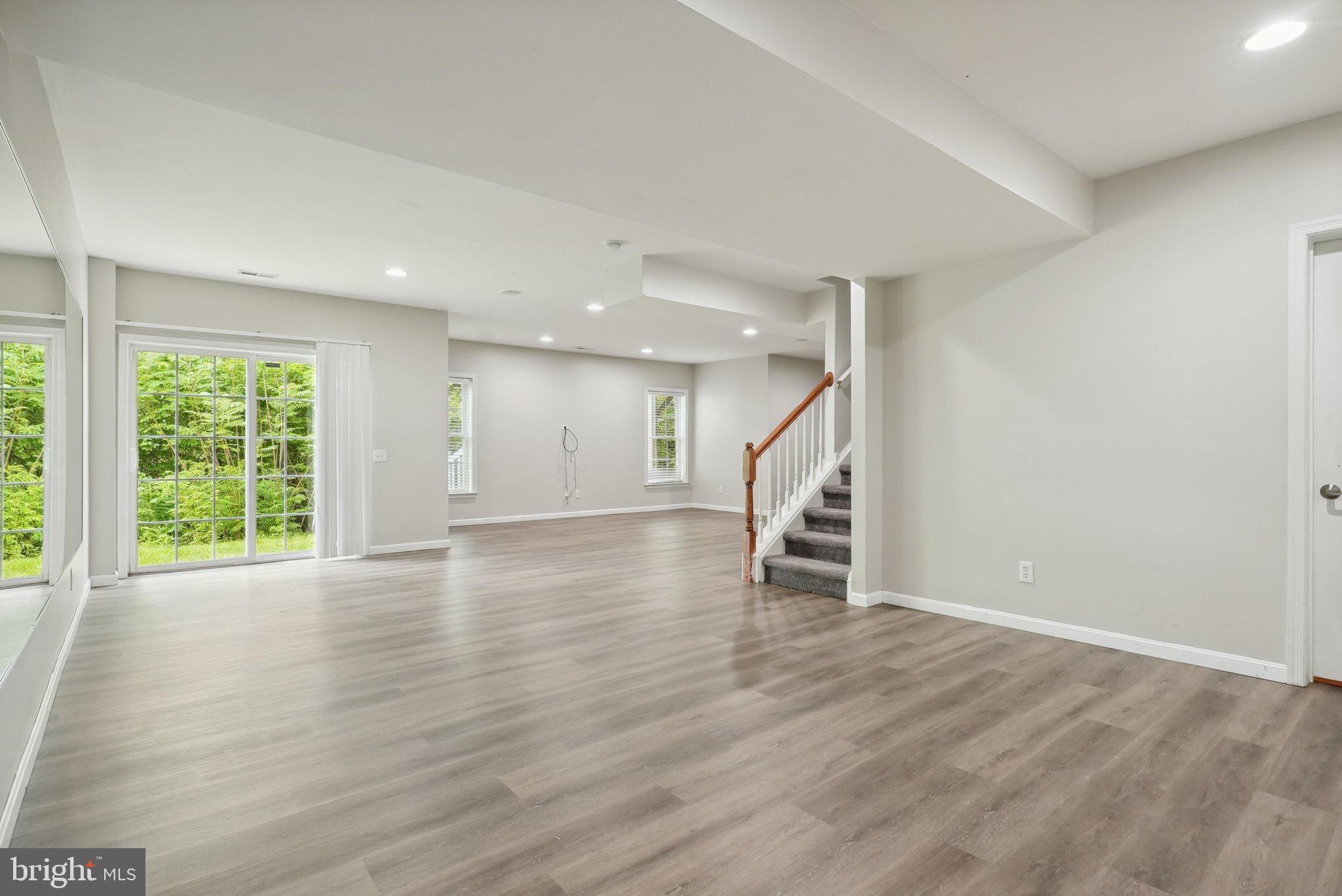 51 Knickerbocker Lane Malvern, PA 19355 - Photo 49 of 57 an empty room with wooden floor and windows
