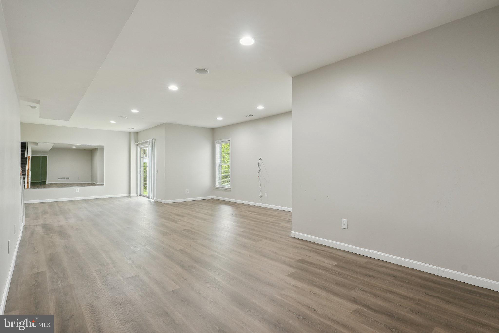 51 Knickerbocker Lane Malvern, PA 19355 - Photo 51 of 57 an empty room with wooden floor and natural light