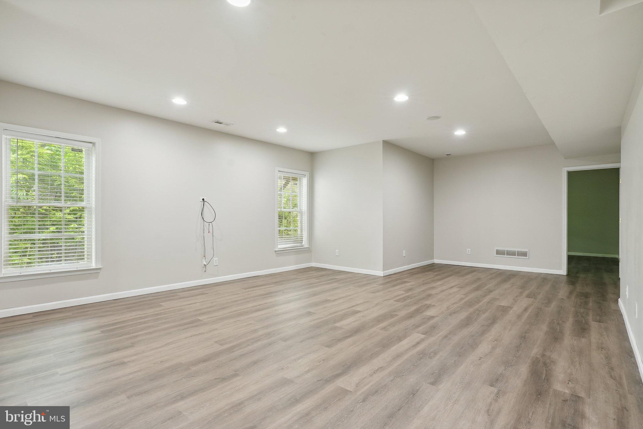 51 Knickerbocker Lane Malvern, PA 19355 - Photo 52 of 57 an empty room with wooden floor and windows