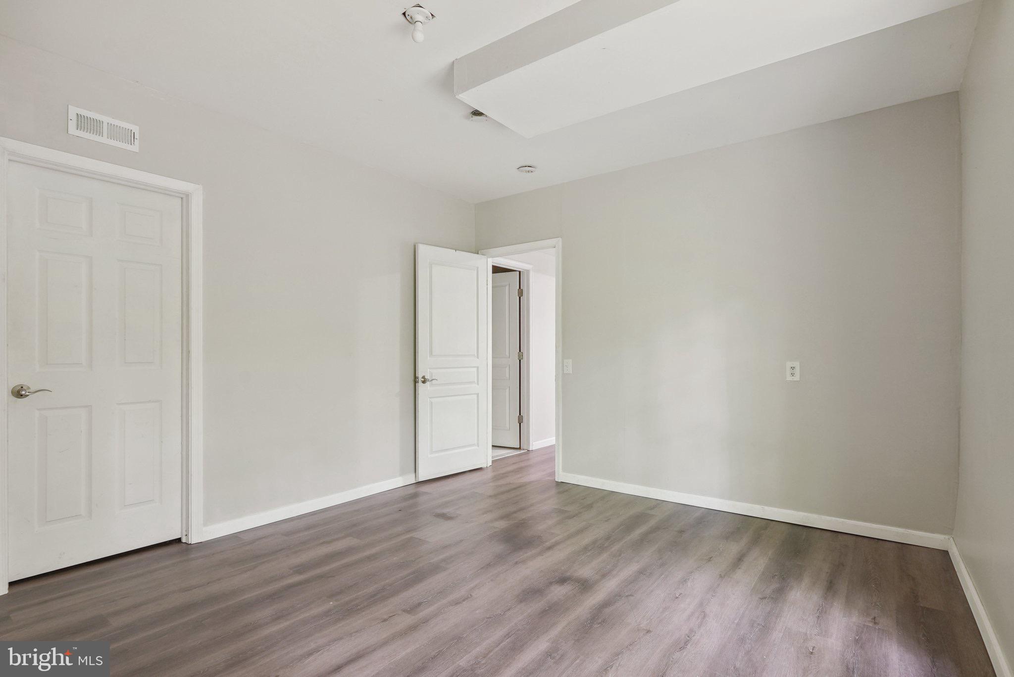 51 Knickerbocker Lane Malvern, PA 19355 - Photo 53 of 57 a view of an empty room with wooden floor