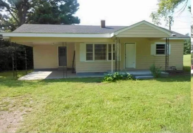 front view of a house with a yard
