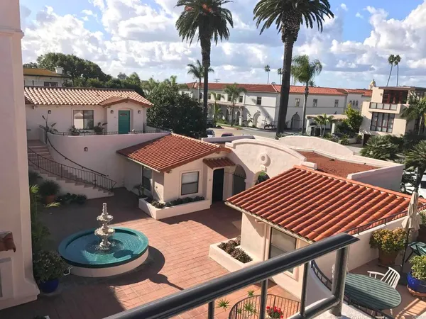 a front view of a house with garden and patio