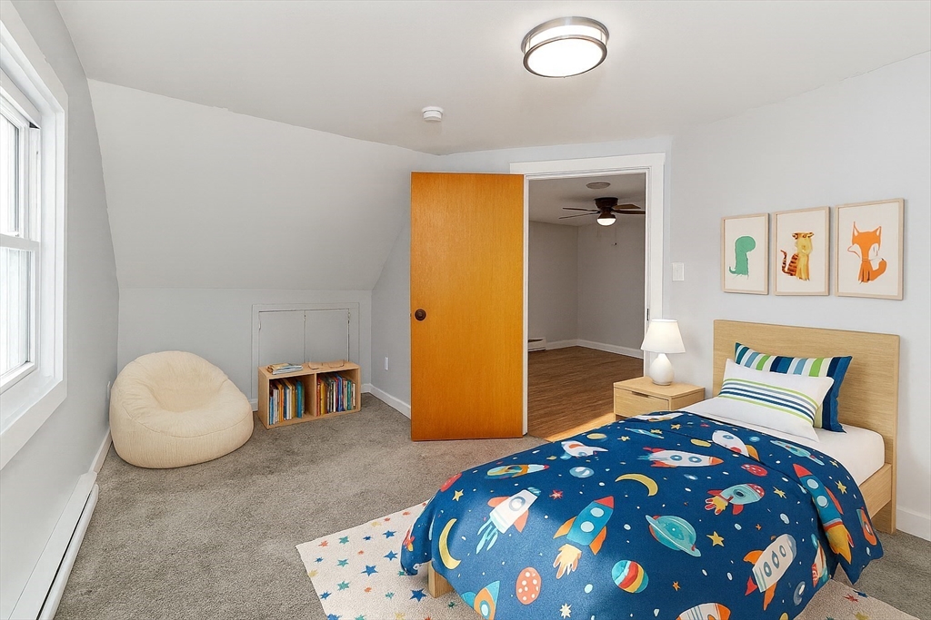 129 Friend Street, Unit 3 Amesbury, MA 01913 - Photo 12 of 30 a bedroom with a bed and dresser