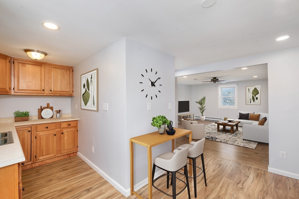 129 Friend Street, Unit 3 Amesbury, MA 01913 - Photo 3 of 30 a living room with furniture and wooden floor