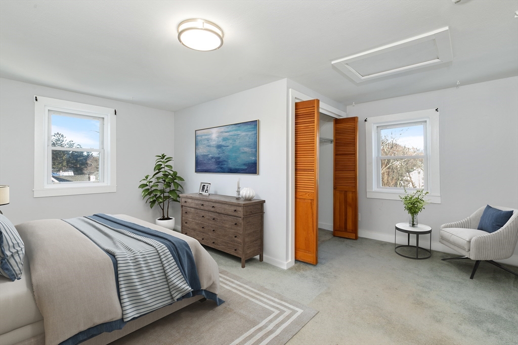 129 Friend Street, Unit 3 Amesbury, MA 01913 - Photo 10 of 30 a bedroom with a bed and a couch