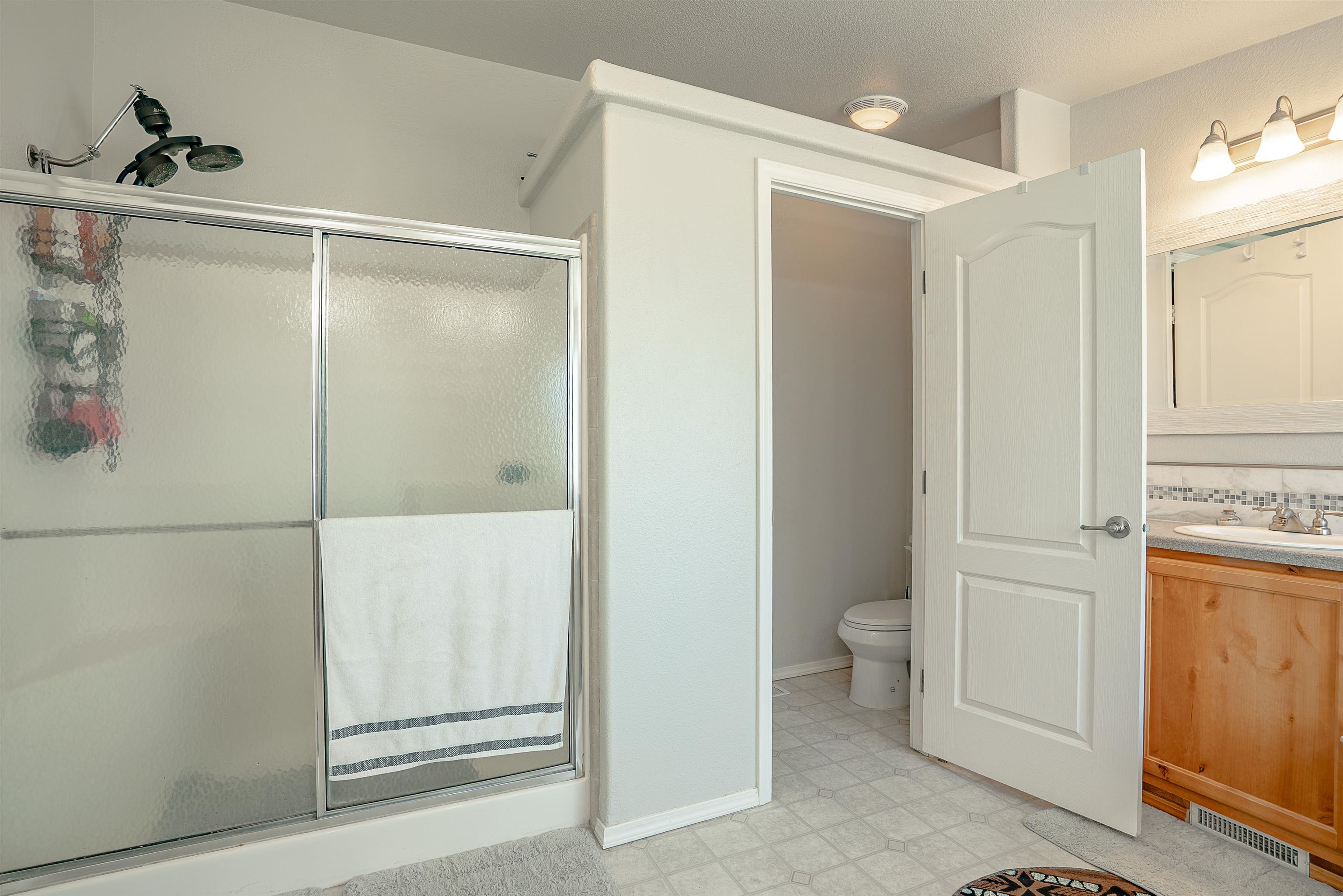714-100 Sears Road Janesville, CA 96114 - Photo 30 of 35 a bathroom with a shower and a toilet