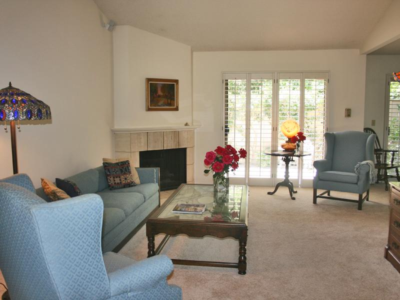 858 Via Granada Santa Barbara, CA 93103 - Photo 2 of 6 a living room with furniture and a fireplace
