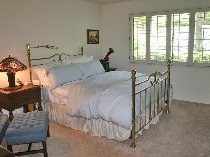 858 Via Granada Santa Barbara, CA 93103 - Photo 4 of 6 a bedroom with a bed and a chair