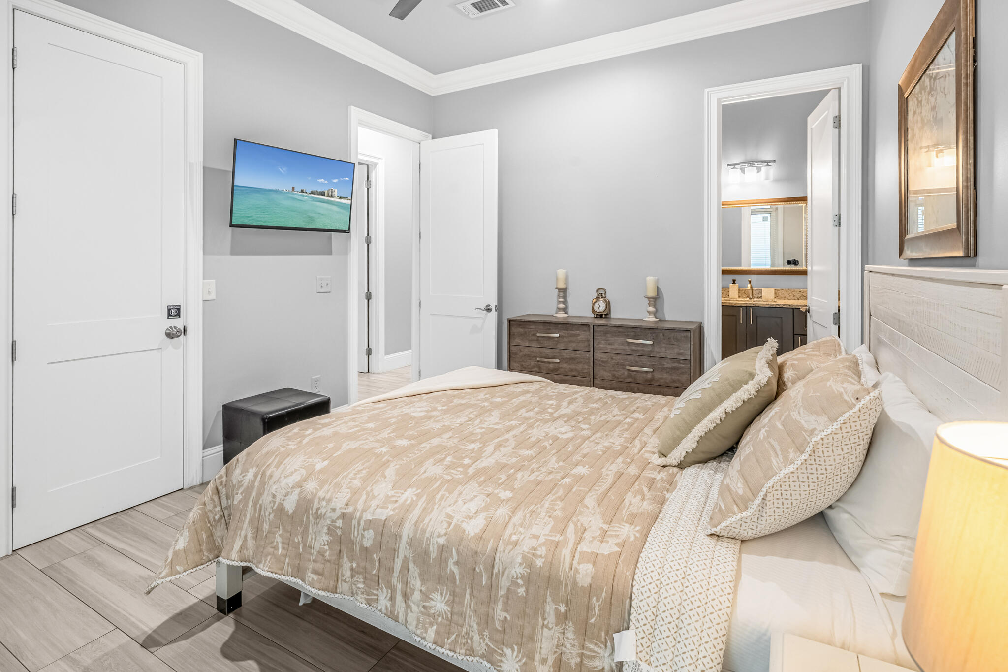 5732 West County Highway 30A Santa Rosa Beach, FL 32459 - Photo 15 of 43 a bedroom with a bed and a chandelier