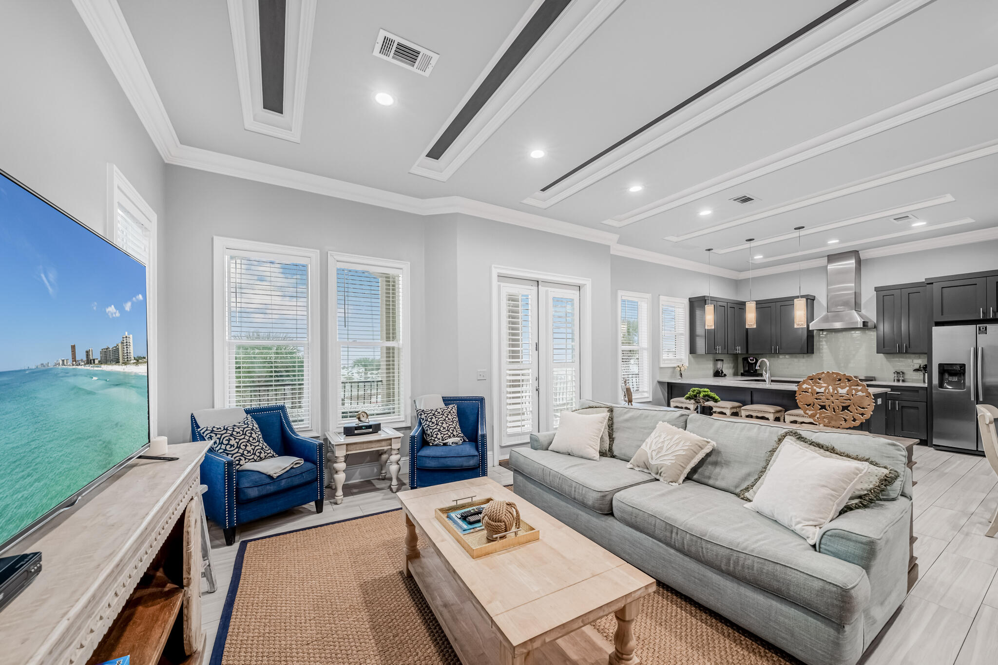 5732 West County Highway 30A Santa Rosa Beach, FL 32459 - Photo 19 of 43 a living room with furniture flat screen tv and a large window