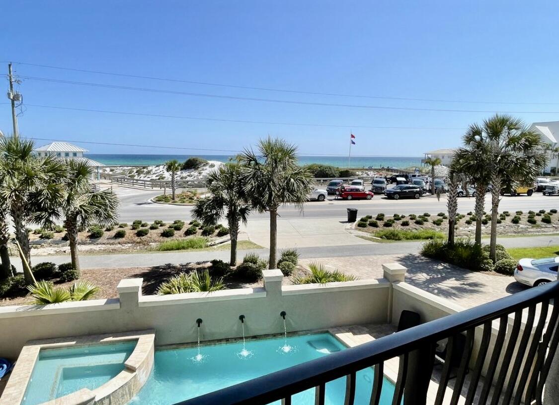 5732 West County Highway 30A Santa Rosa Beach, FL 32459 - Photo 2 of 43 a view of a swimming pool with a yard and mountain view