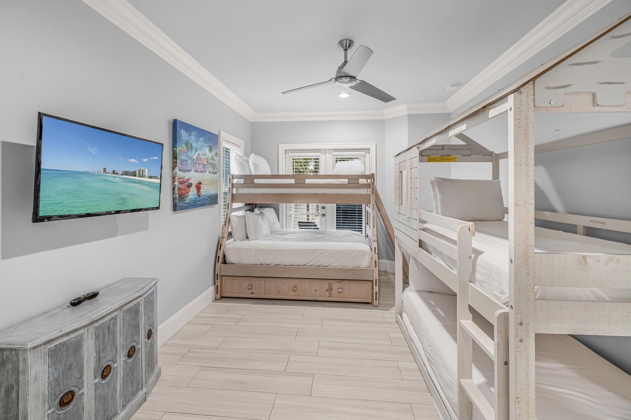 5732 West County Highway 30A Santa Rosa Beach, FL 32459 - Photo 34 of 43 a spacious bedroom with a bed and a flat screen tv