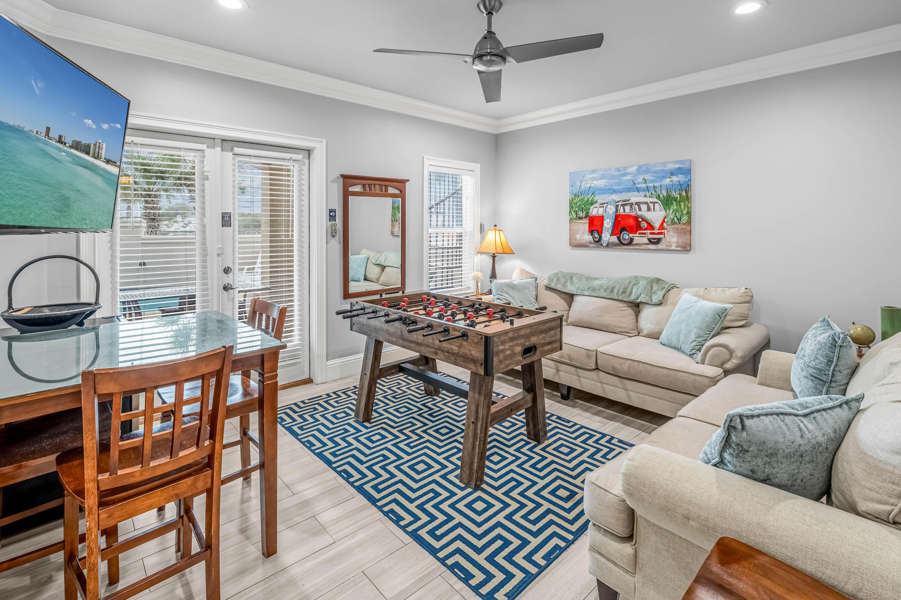 5732 West County Highway 30A Santa Rosa Beach, FL 32459 - Photo 36 of 43 a living room with furniture a ceiling fan and a window