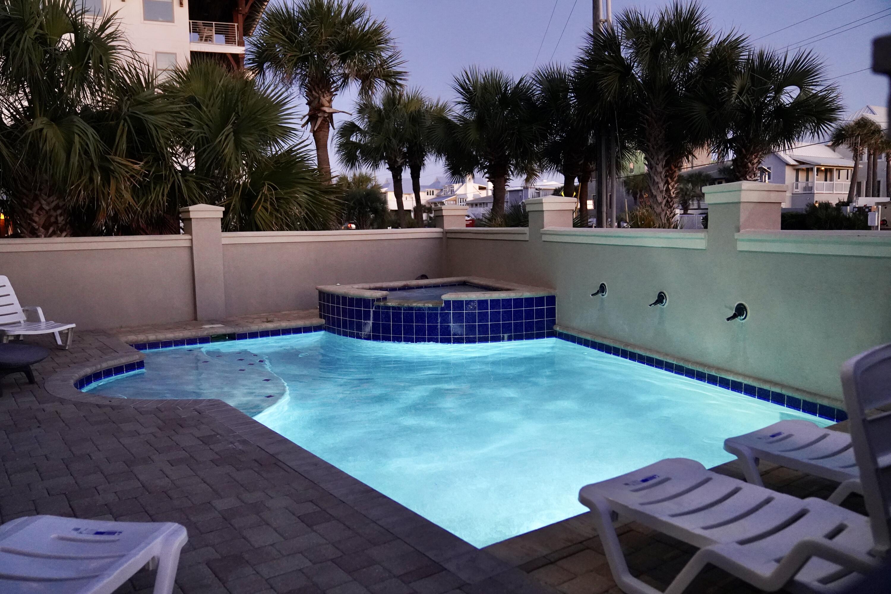 5732 West County Highway 30A Santa Rosa Beach, FL 32459 - Photo 6 of 43 a backyard of a house with table and chairs