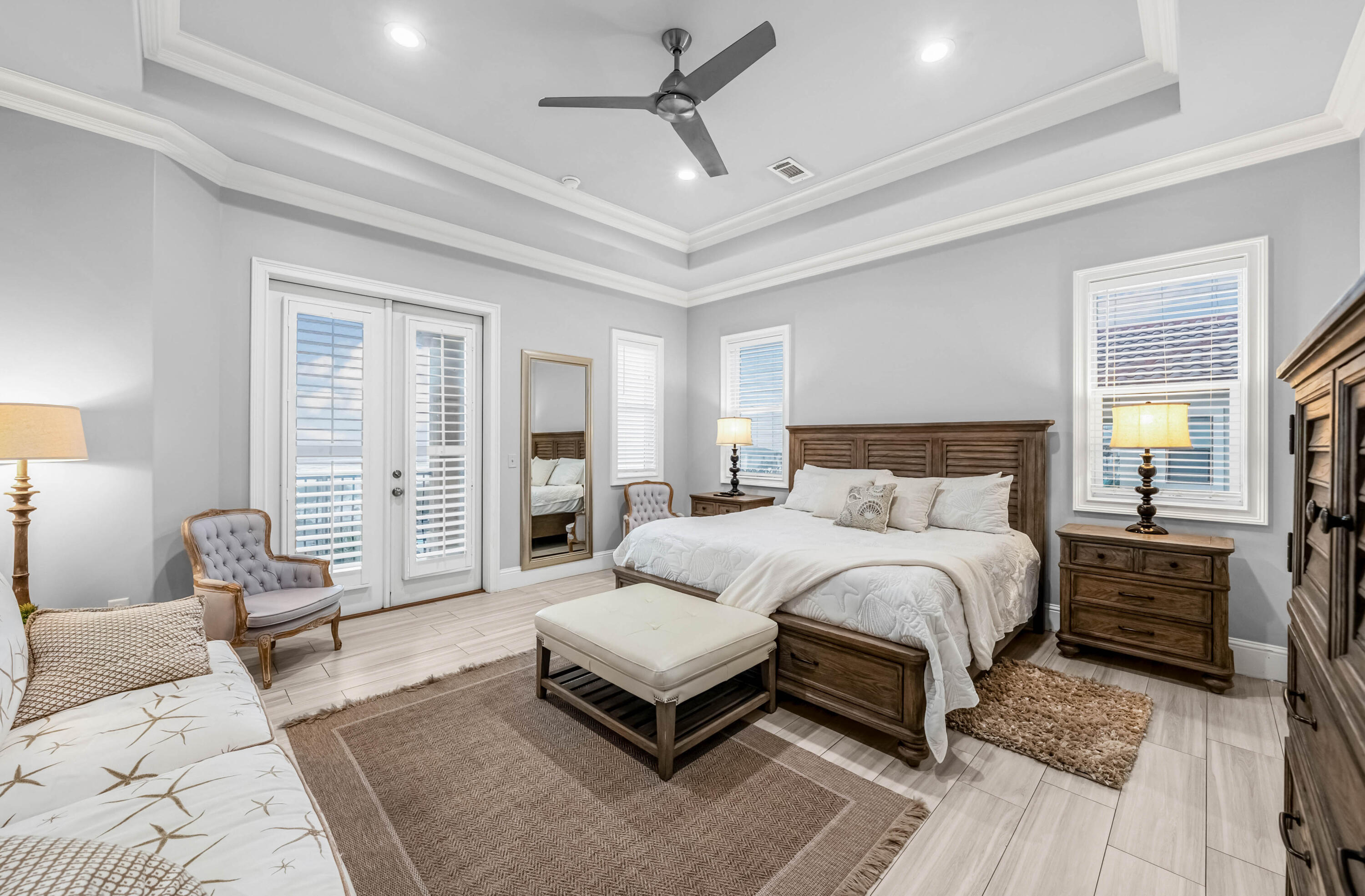 5732 West County Highway 30A Santa Rosa Beach, FL 32459 - Photo 8 of 43 a spacious bedroom with a bed a couch and large window