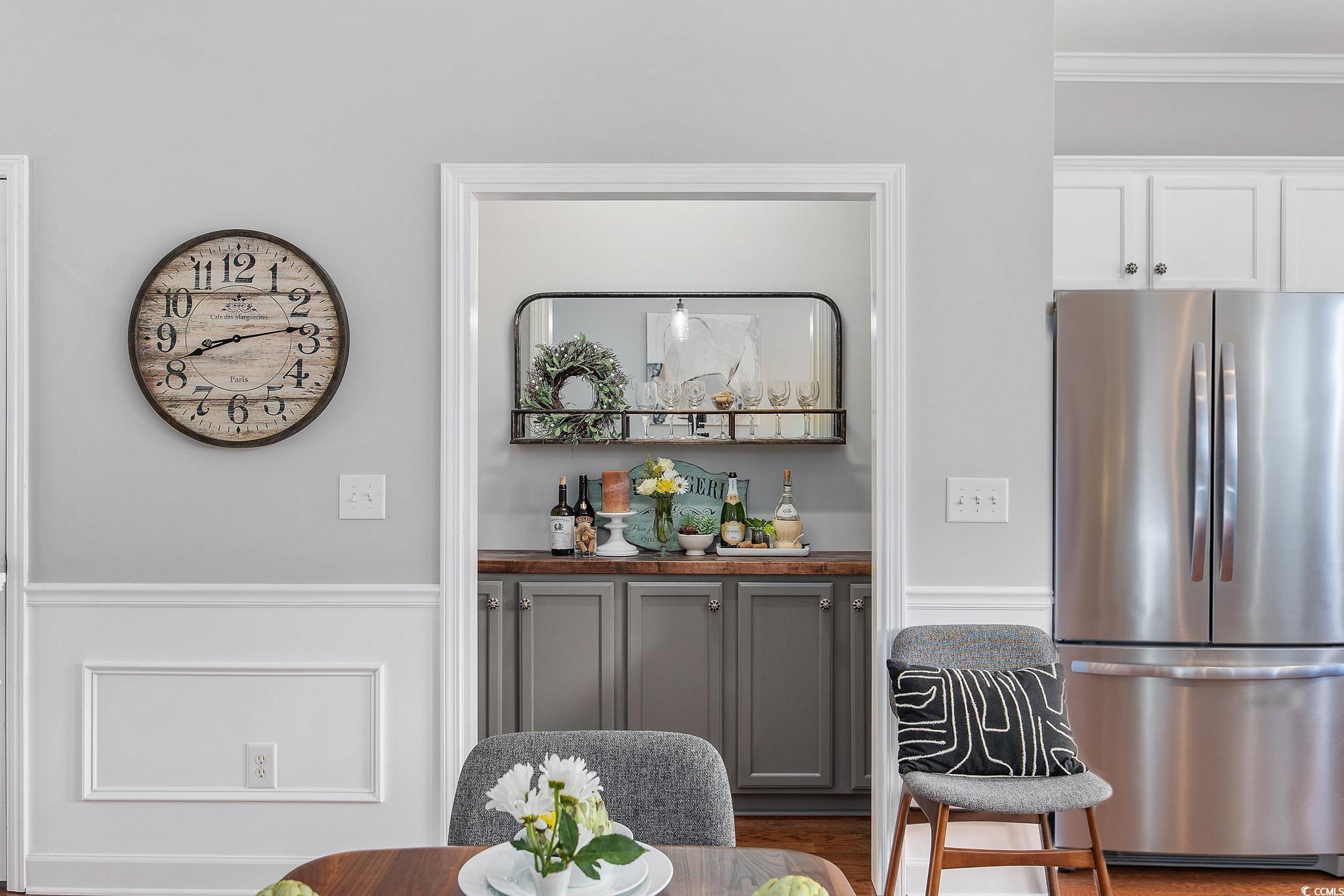 751 Murray Avenue, Unit 751 Myrtle Beach, SC 29577 - Photo 12 of 34 Dining room featuring crown molding and hardwood /