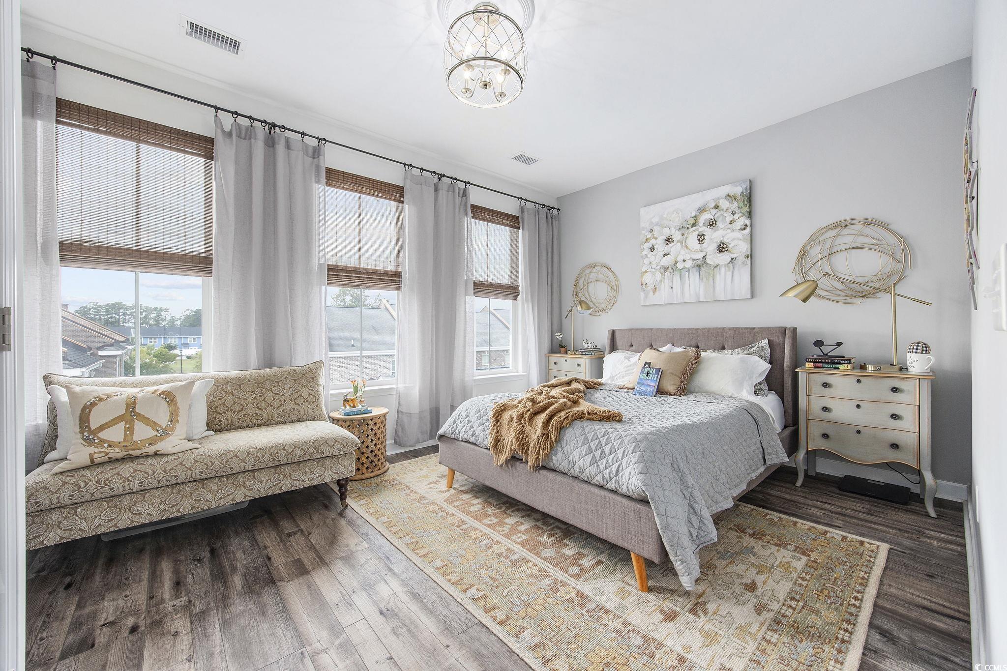 751 Murray Avenue, Unit 751 Myrtle Beach, SC 29577 - Photo 16 of 34 Bedroom with a chandelier and hardwood / wood-styl